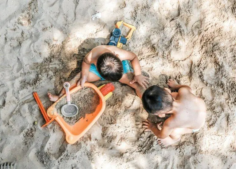 Boys playing in a sandpit